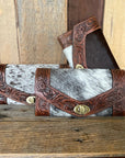 Cowhide tooled western wallet multiple wallets together on display
